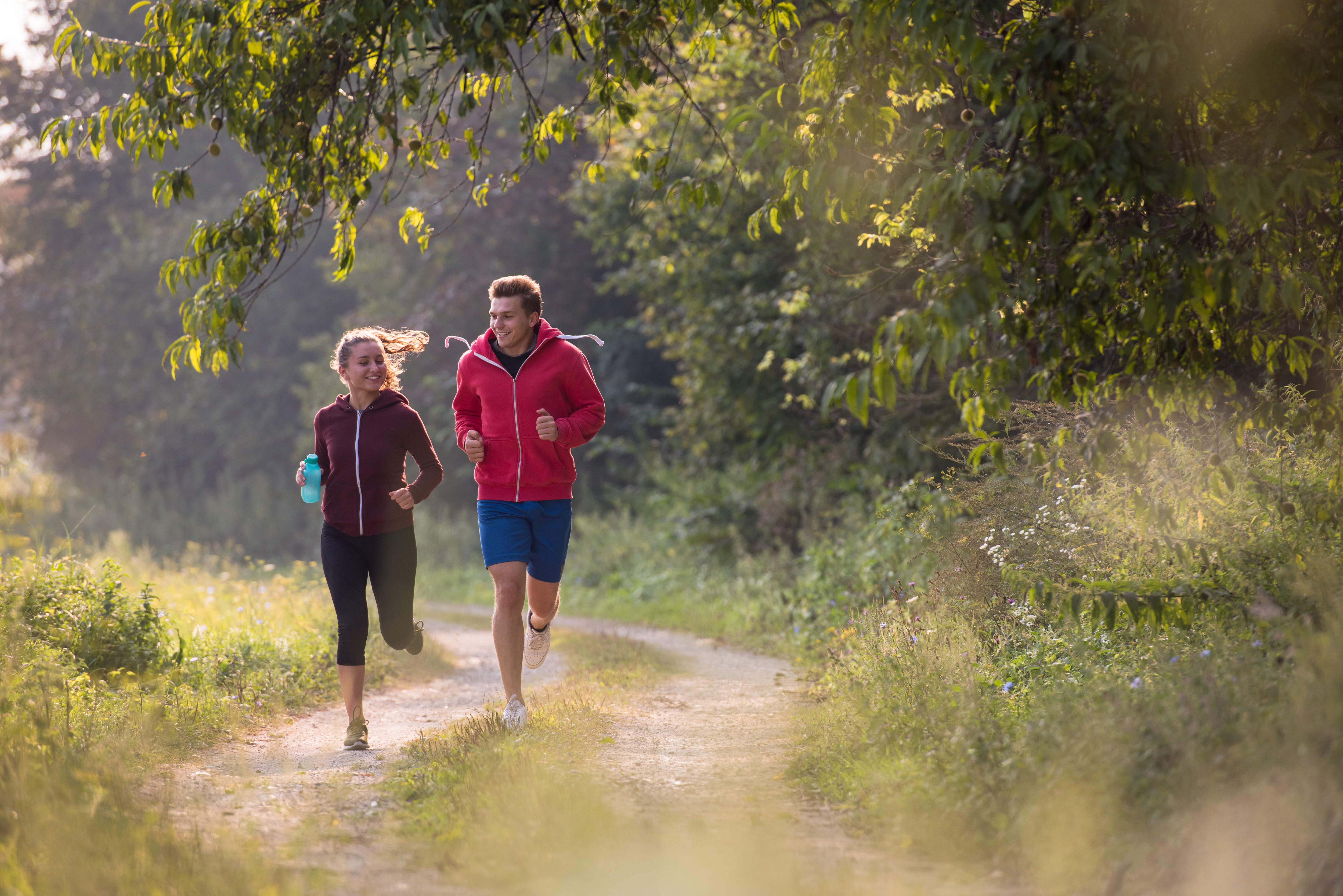 Young couple running outdoors